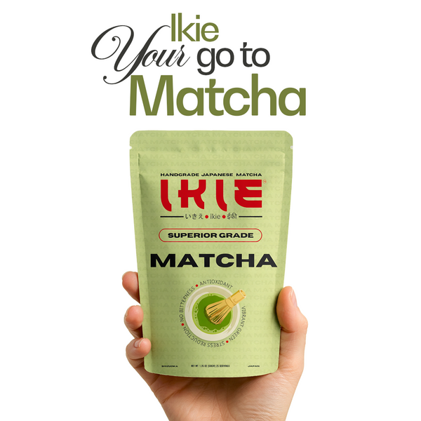 Hand holding a green package of Ikie Matcha with text 'Your go to Matcha' on a white background